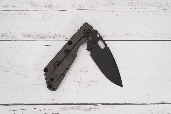 Strider Knives - SnG Monkey Edge FRAG Pattern - Grey G10 bundle with Strider Lighter Brass Topography sold by SellYourKnife